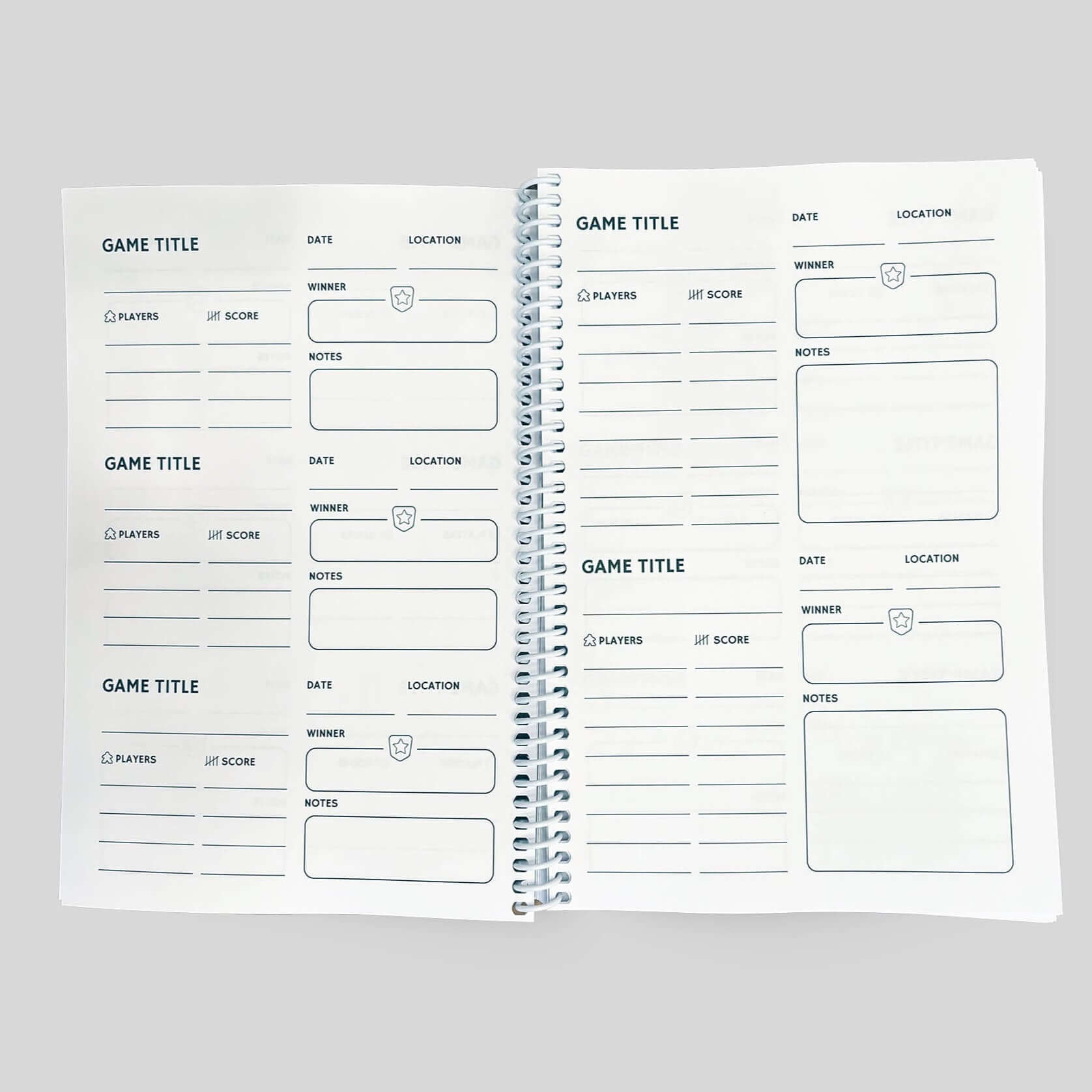 Interior pages of the Game Night Remembered journal designed for tracking board game details and results.