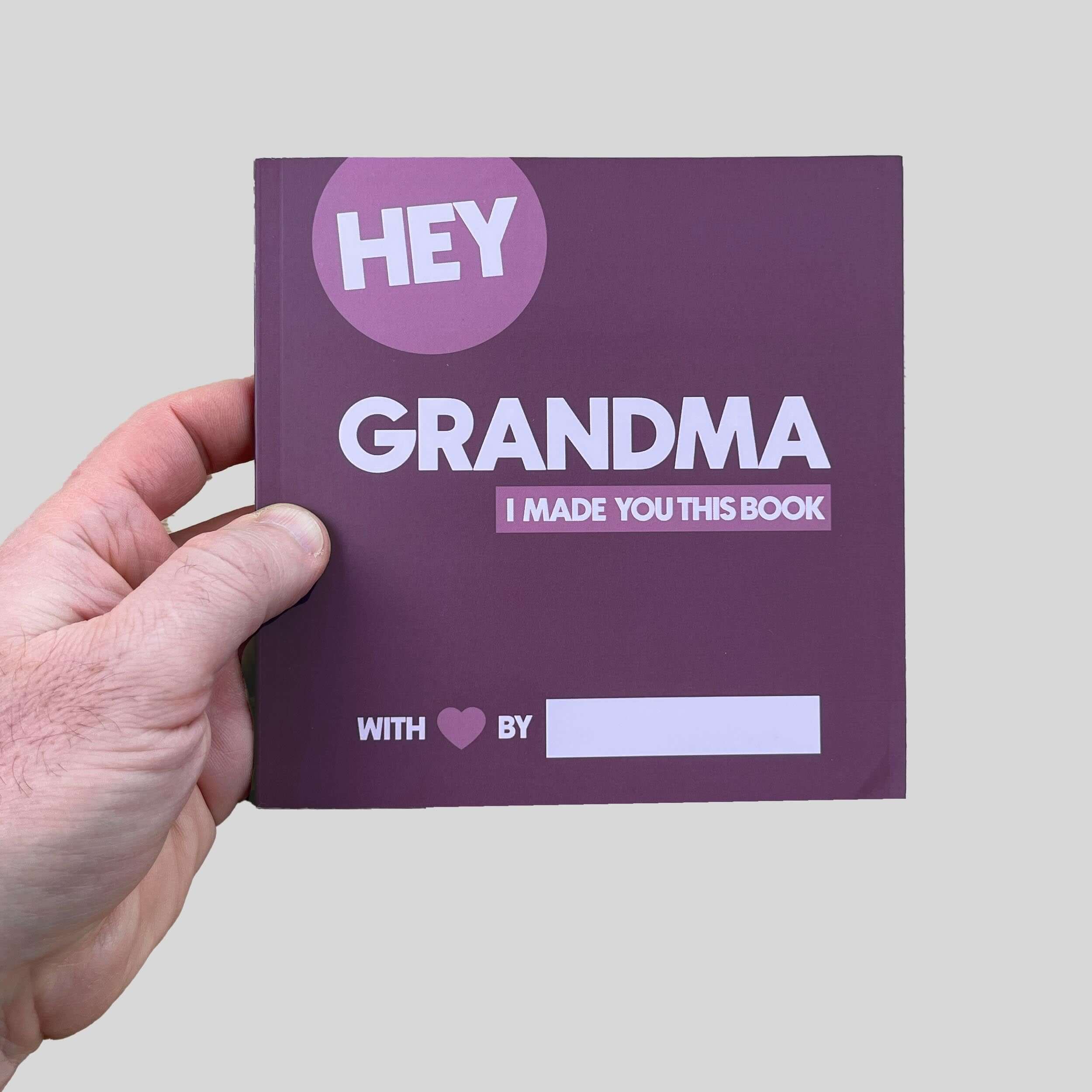 Person holding Hey Grandma fill-in-the-blank memory book - personalized grandmother gift