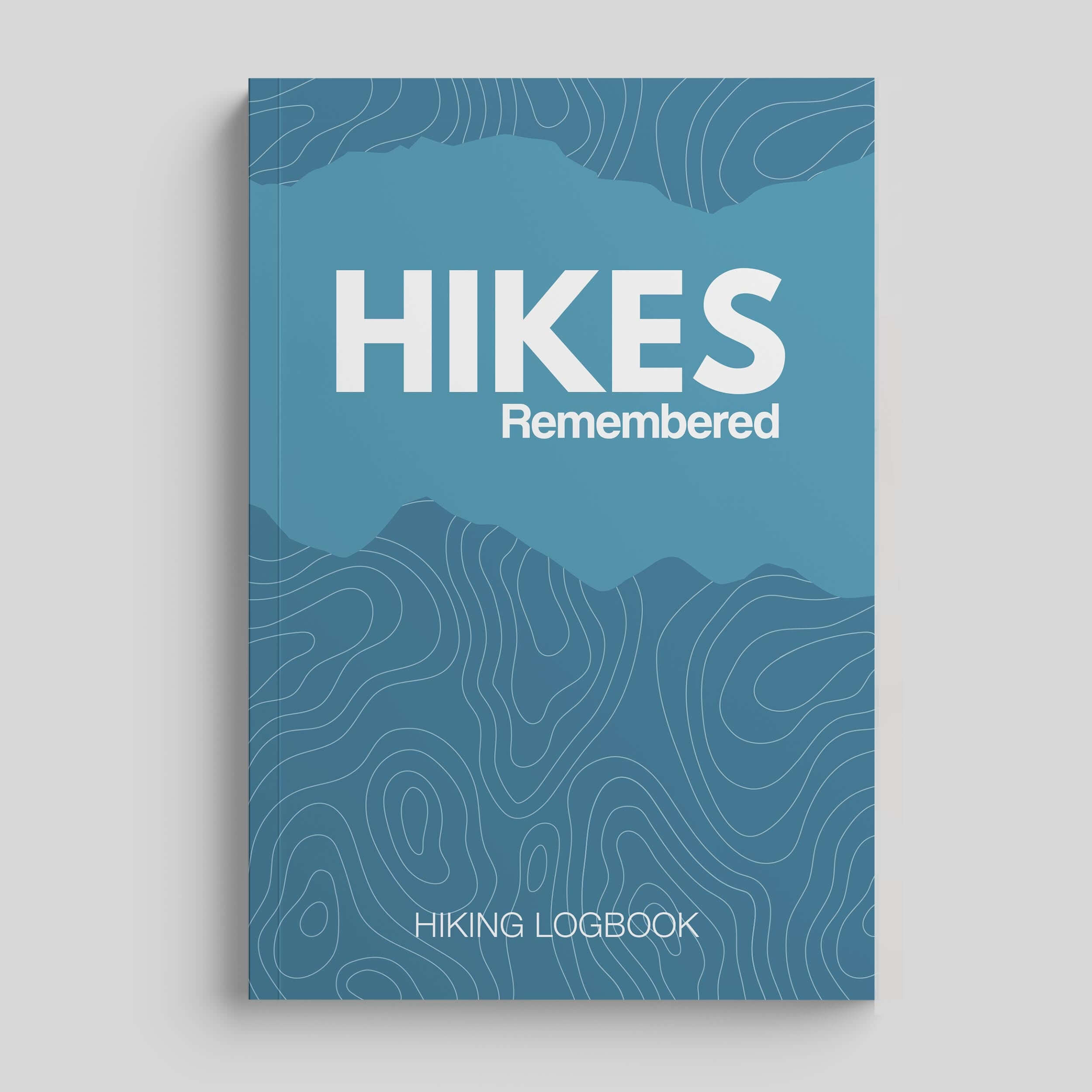 Hikes Remembered hiking logbook journal with a blue cover featuring topographic design and bold title.