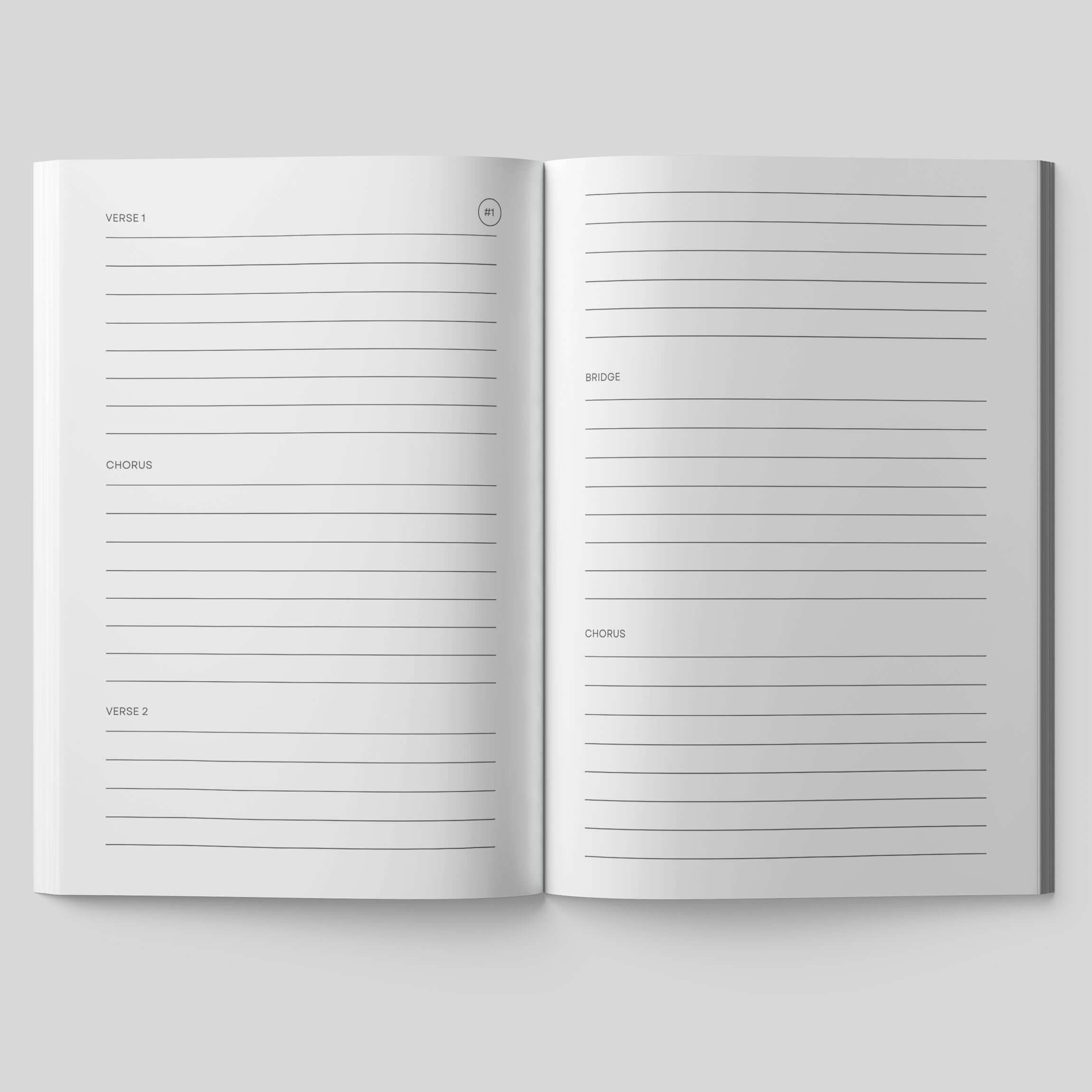 Open pages of a songwriting journal with sections for verses, chorus, and bridge to capture lyrics.